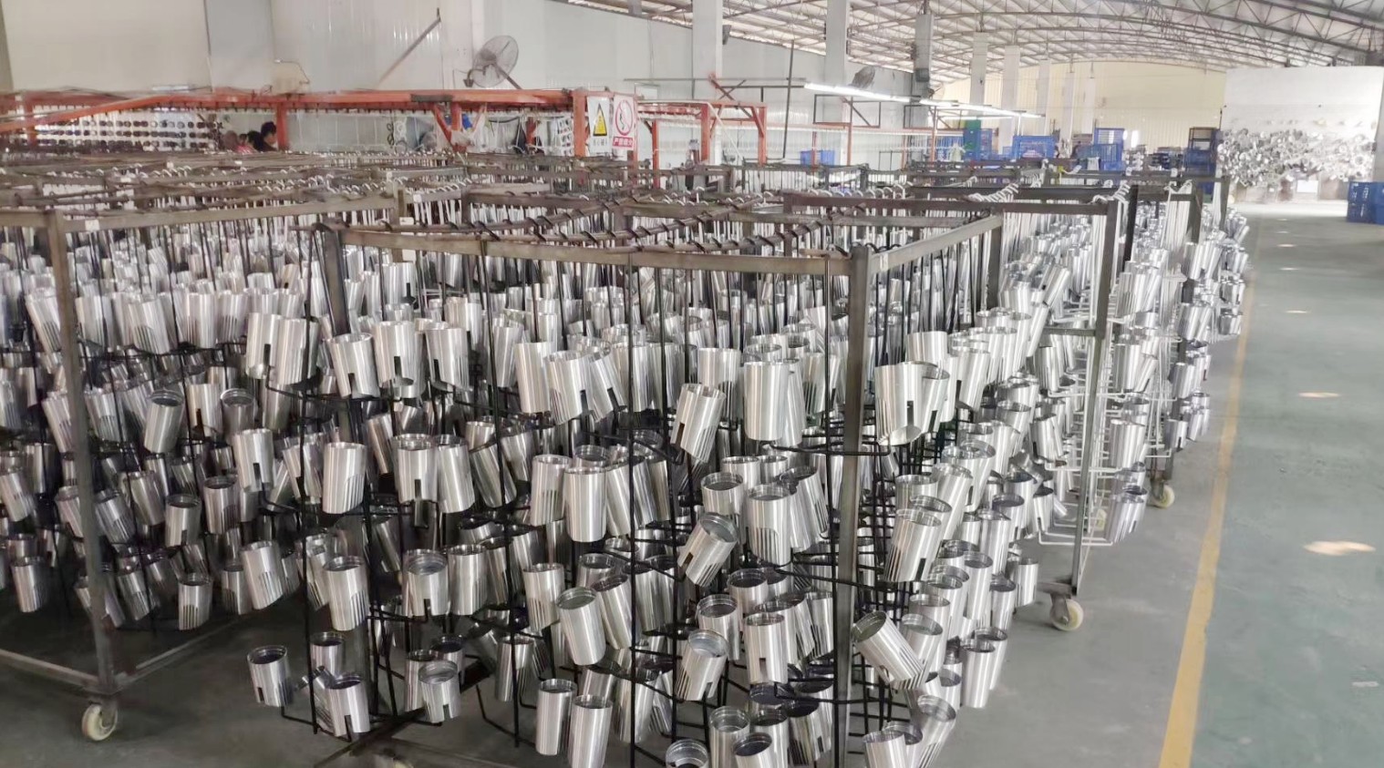 ECOLEDKIT quality control inspection - finished die-cast aluminum LED downlight housings on inspection racks